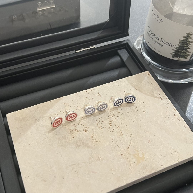 G*u*i earrings